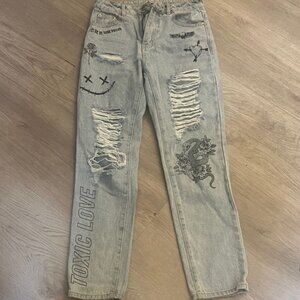 Distressed Gray Women's Jeans with Graphic Details